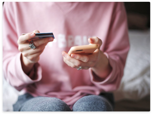 woman holding cell phone