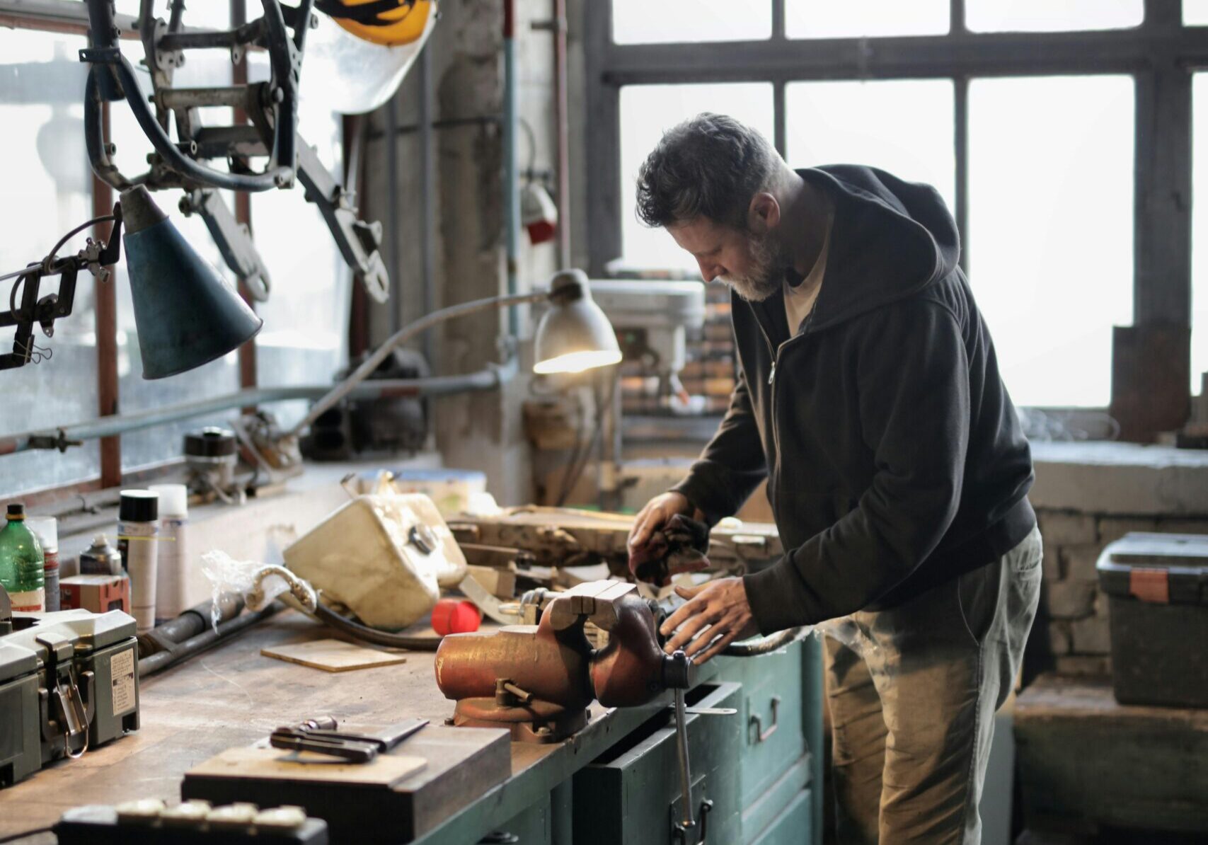 INSBANK A man using a workbench